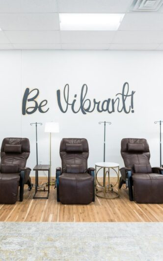 A room with five comfortable electric reclining lounge chairs in a med spa room Three comfortable leather med spa recliners